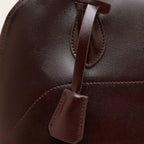 Sac bandoulière demi-lune en cuir glossé Marron